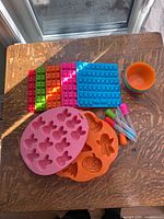 Top view showing all silicone moulds, baking cups stack and droppers