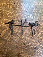Full view of metal branch wall hook showing two birds and three hooks