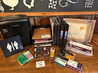 Full lot overview showing shredder, organizer, binders, frames and assorted packaged supplies