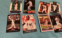 Fronts of all eight baseball cards displayed