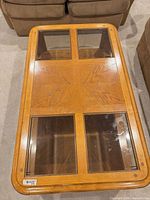 Top view showing wood veneer pattern and four glass insets