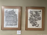 Both framed cartoons side by side on wall