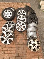Group shot of all wheels, tires, spares and jacks