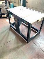 Full view of Craftsman rotary tool bench assembled except top center, showing steel frame and wood top