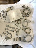 Top-down view of all items: external CD-R drive, Apple mouse, ADB cable, multiple SCSI cables/adapters, terminators