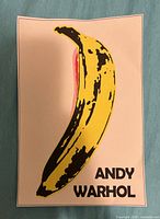 Front view of the banana print showing full artwork and artist name