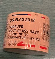Front view showing label: U.S. Flag 2018, Forever, coil of 100
