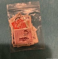 Front view of bag showing Mauritius 20¢ stamp and others inside
