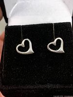 Front view of both open heart studs on display pad