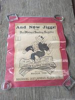 Full view of newspaper promotional poster with glass weights
