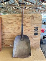 Front view of full shovel showing blade, handle, and D-grip