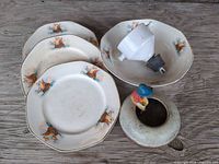 Group view of plates, bowls, planter and insulator