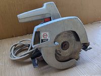 Full view of the Black & Decker corded circular saw with blade and cord visible