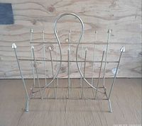 Front view of chrome rack showing handle, dividers and feet