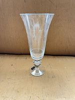Full view of clear glass trumpet pedestal vase