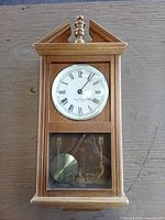 Full front view of clock showing overall design and condition