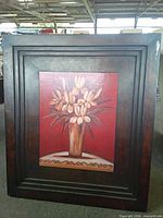 Front view showing painted floral still life and wood frame