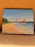 Front view of entire painting showing sailboats on beach