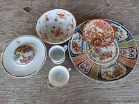 Group shot showing platter, bowls, cups and covered dish
