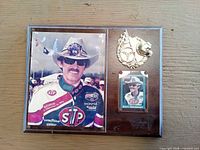 Full view of plaque showing photo, card and emblem