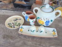 All seven ceramic pieces grouped together