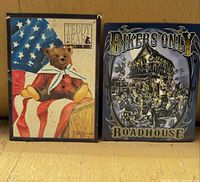 Front view of both tin signs showing designs and scale