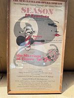 Full view of framed season poster showing design and frame