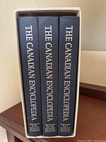 Spines of three volumes inside slipcase