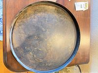 Top view showing black tray with gold-flecked patina