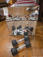 Mirror front view with dumbbells in front