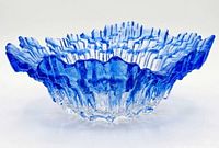 side view showing jagged rim and blue to clear gradient