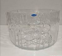 Front view of clear Nuutajarvi Flora glass bowl showing botanical relief pattern