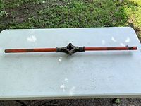 Full view of pipe bender showing length and handle