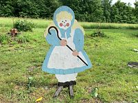 Front view of painted Bo Peep cutout standing on ground