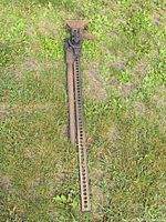 Full view of entire 48-inch farm jack lying on grass