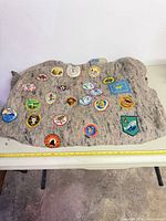 Full view of wool poncho displaying placement of Boy Scout patches