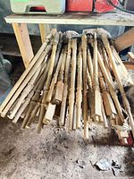Pile of wooden spindles on workbench