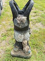 Full view of planter front showing overall shape, cat in pocket, squirrel on leg