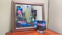 Mirror and vase together showing scale and painted designs