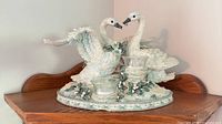 Dual swan candleholder figurine with glass cups