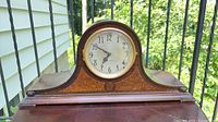 Front view of Seth Thomas tambour mantel clock on table