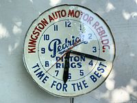 Front view of clock showing full dial and graphics