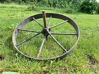 overall view of iron wheel lying on grass
