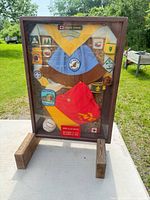 Full view of wood display case with scouting items