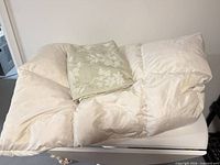 Folded queen duvet insert with duvet cover on top