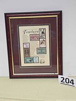 Full view of framed Teachers Collection stamp art in burgundy wood frame