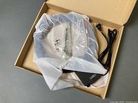Ring light in original box with AC adapter, hardware and cord