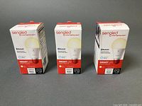 Three sealed Sengled Smart LED bulb boxes front view