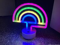 Rainbow LED neon light illuminated on floor