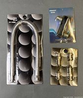 All three retail-packaged photo studio grip accessories